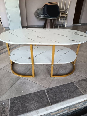 Oval coffee table with marble effect
