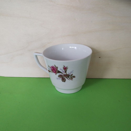 Vintage porcelain cup with roses and angled handle like new