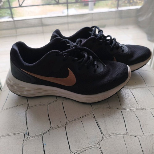 Nike shoes size 38.5 used, black with gold logo, athletic