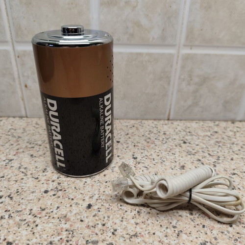 Vintage telephone shaped like a battery, like new