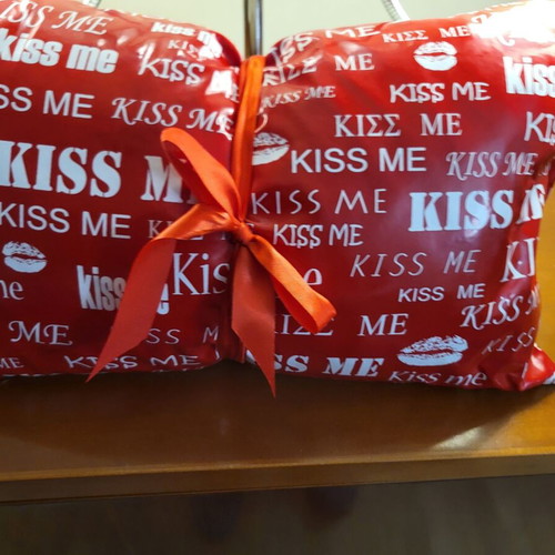 Plastic Kiss Me pillow new with ribbon
