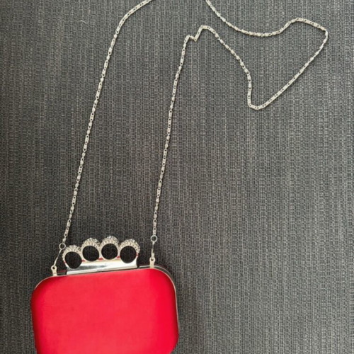 Red clutch like new with decorative clasp and chain