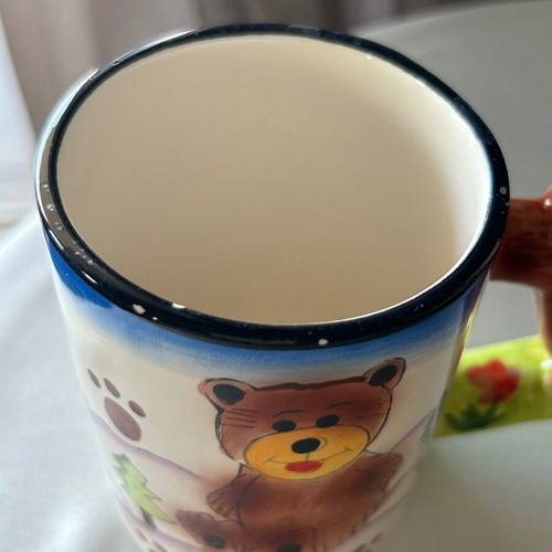 Vintage children's ceramic mug used with embossed designs