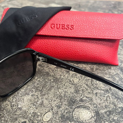 Guess women's sunglasses with red protective case and black cloth