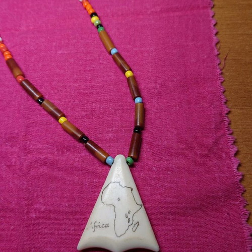 African necklace like new with cloth for storage or cleaning
