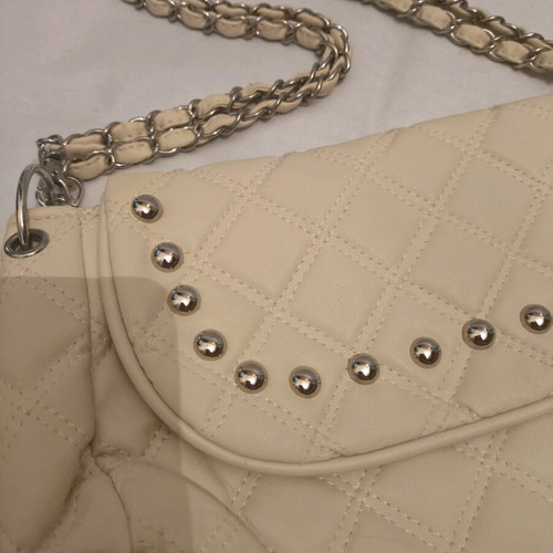 Women's shoulder bag like new, milky color with silver details
