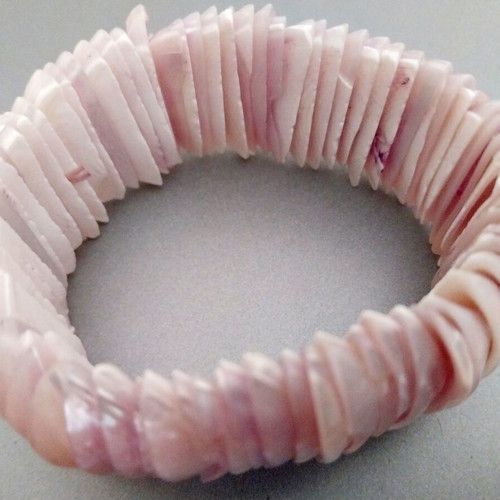 Jewelry set used in lilac shades with necklace, ring, and shell bracelet