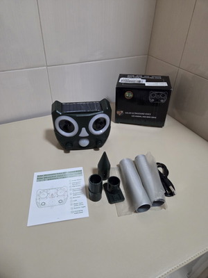 Solar ultrasonic animal and bird repellent owl head with LED eyes