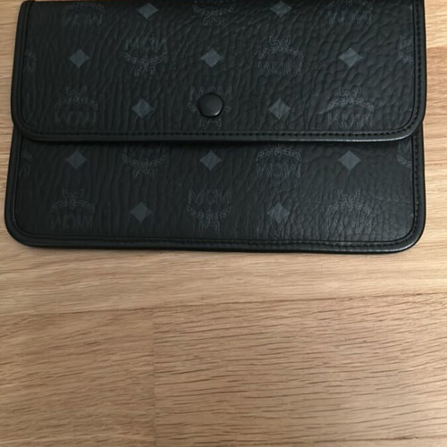 MCM collectible black crossbody bag like new with detachable pouch