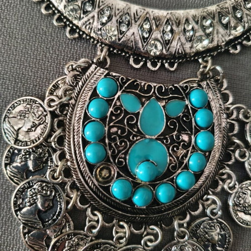 Steel necklace like new, missing one turquoise stone