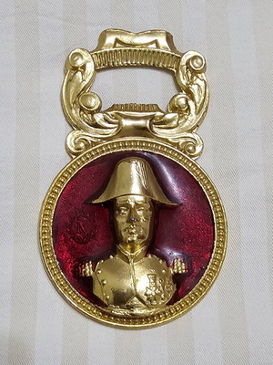 Collectible metal bottle opener with Napoleon bust and red enamel
