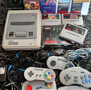 SNES + 3 games + 5 controllers + booklets