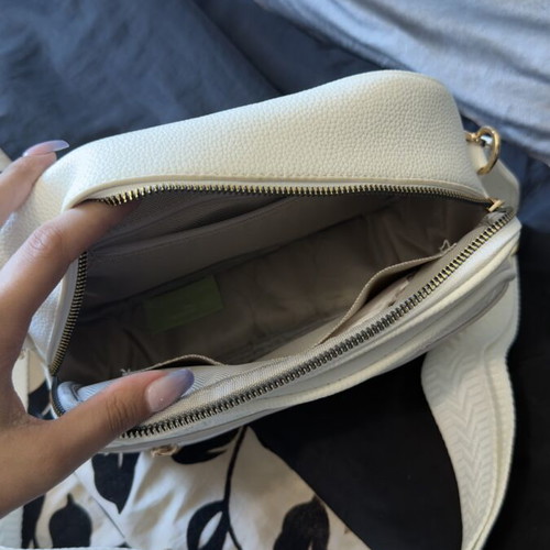 White bag with gold details and unique design, new