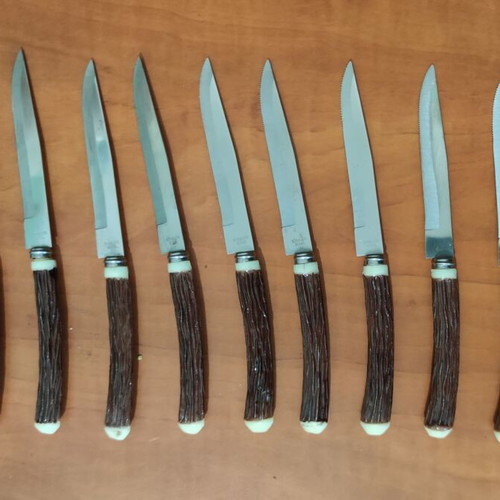 Vintage steak knives set of 9 with faux antler handles like new