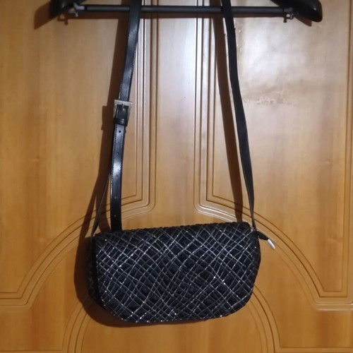 Black shoulder bag with embossed geometric pattern, like new