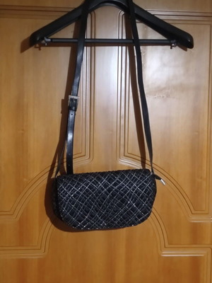 Black shoulder bag with embossed geometric pattern, like new