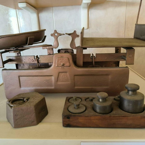 Old mechanical scale with authentic weights, vintage