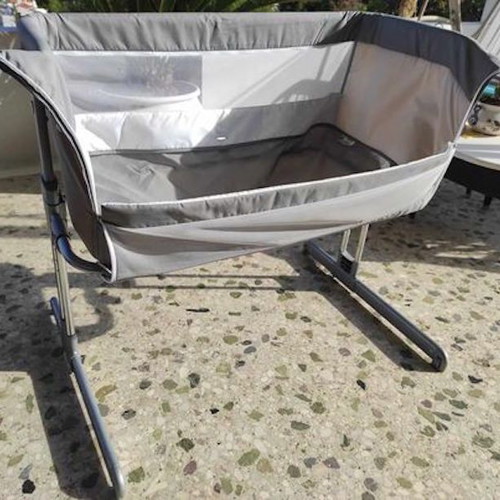 Safety baby cot used with side opening and adjustable height