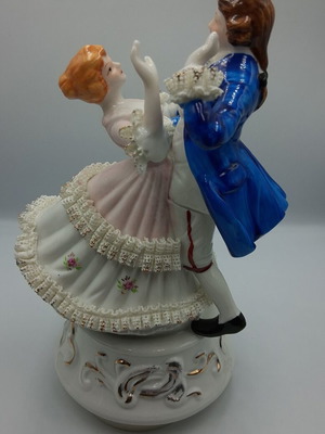 Vintage porcelain music figurine of dancing couple, like new