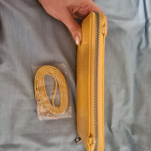 Yellow wallet used with strap