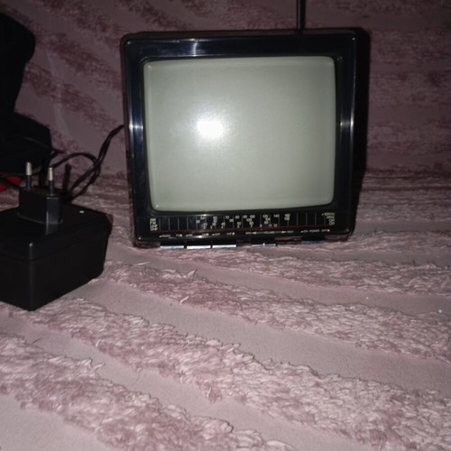 Vintage portable black and white television with radio like new