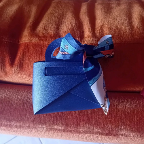 Gift packaging bag made of artificial leather new, blue with ribbon