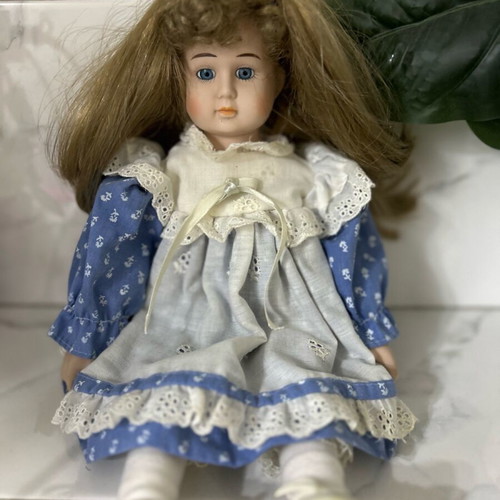 Porcelain doll Germany from the 70s like new