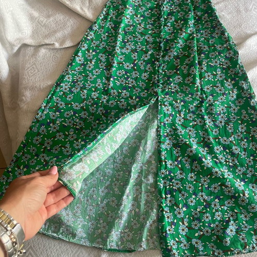 D&K skirt like new with front slit and decorative buttons, white and green
