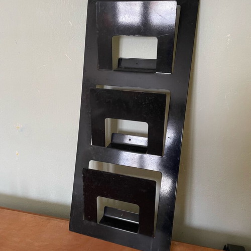 Ikea wall-mounted magazine stand used, black color