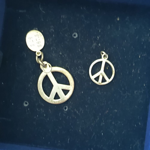 Peace symbol silver pendants set like new, two pieces