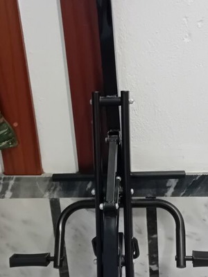 Elliptical rowing fitness machine