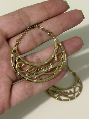Guess goldtone dangling earrings with rhinestones