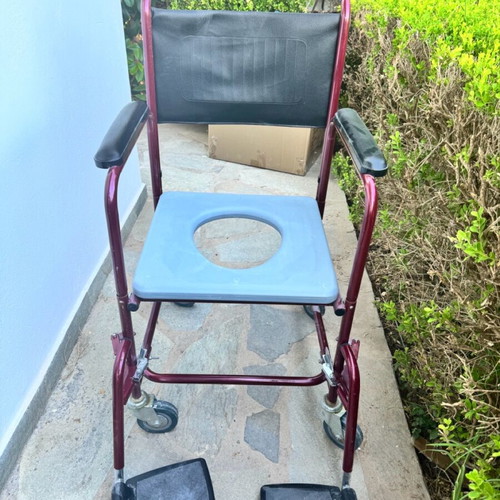 Red toilet wheelchair like new, missing container