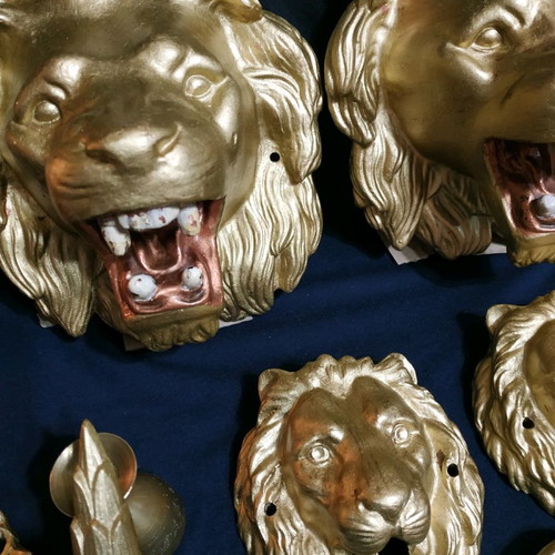 Decorative items used, cast iron lion heads, old antiques