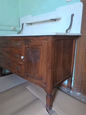 Old wooden dresser with marble top and carved floral details