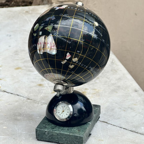 Decorative globe made of semi-precious stones with clock and marble base used