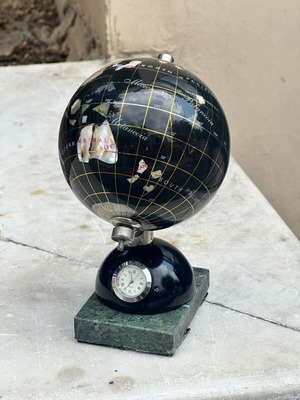 Decorative globe made of semi-precious stones with clock and marble base used