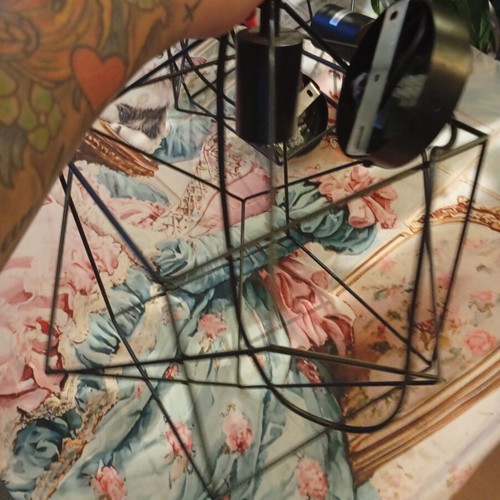 Two rhombic metal ceiling lights