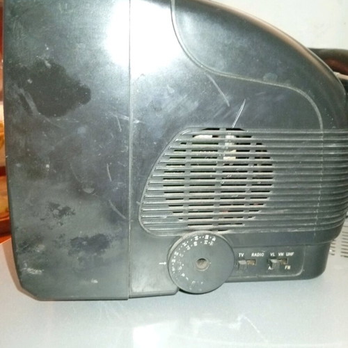 Silver portable radio TV used with AV and car adapter