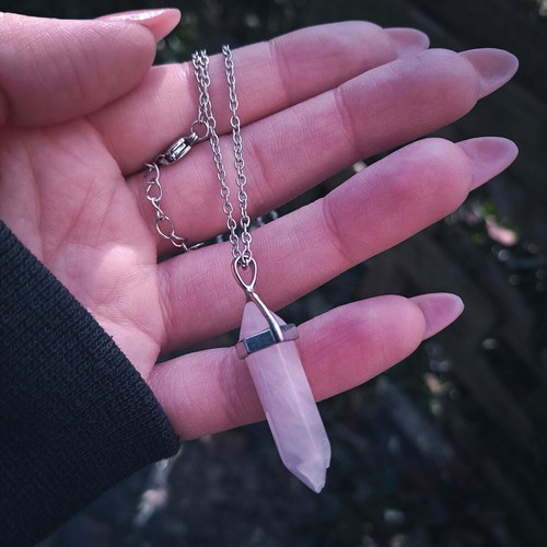 Rose quartz crystal pendant used with silver chain