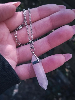 Rose quartz crystal pendant used with silver chain
