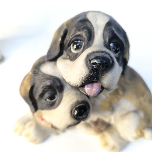Decorative resin figurine of two puppies used