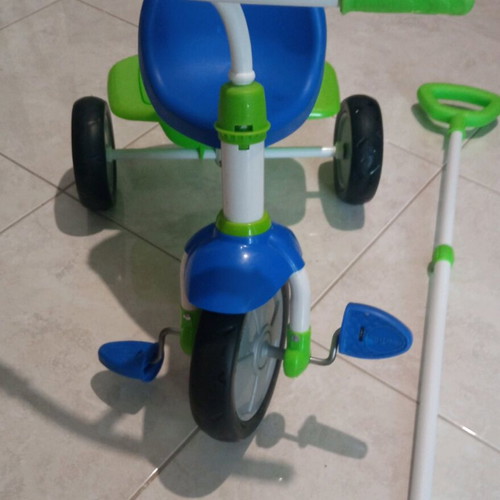 Children's tricycle bike with handle like new, blue and green