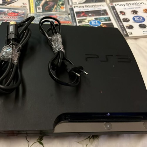 PlayStation 3 Slim console like new with 9 games and 2 demo discs