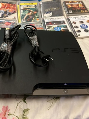 PlayStation 3 Slim console like new with 9 games and 2 demo discs