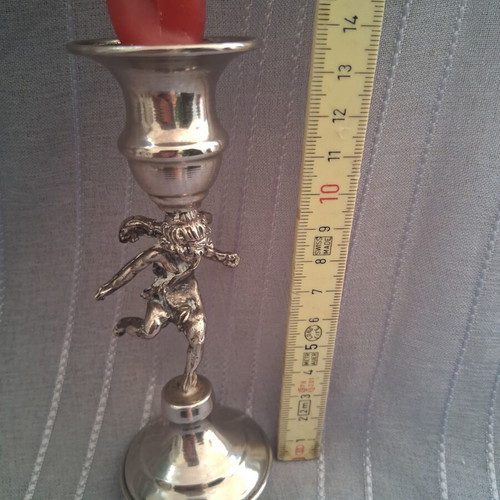Vintage candlestick with cherub figure