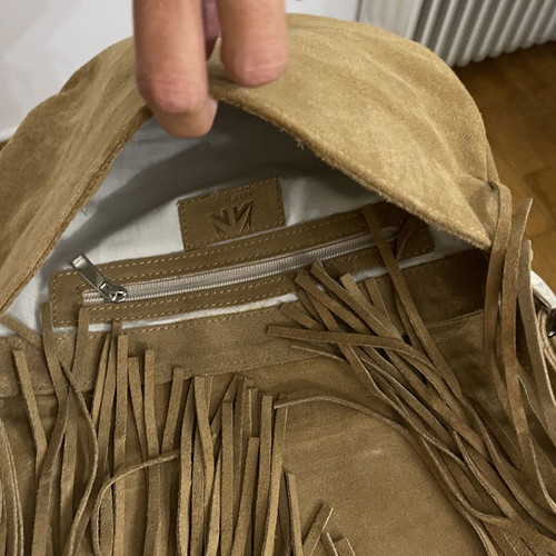 Suede leather shoulder bag used with fringes and silver details