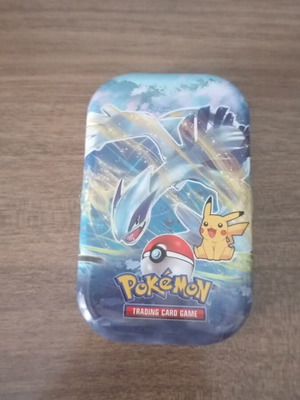 Pokémon trading card mystery metal pack with 65+ cards