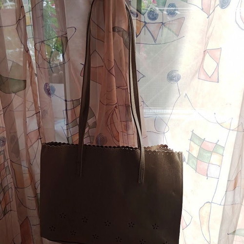 Women's shoulder bag metallic silver with flower cutouts