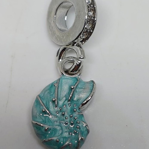 Silver charm with blue enamel Nautilus like new